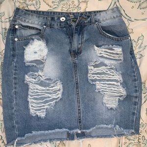 Faded ripped denim skirt